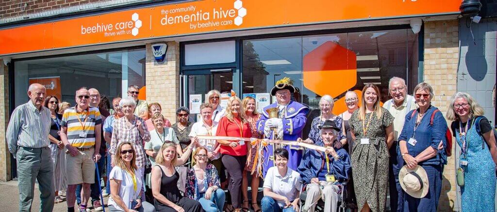 Beehive Care official launch photo outside the Lancing Dementia Hive with Worthing Town Crier.