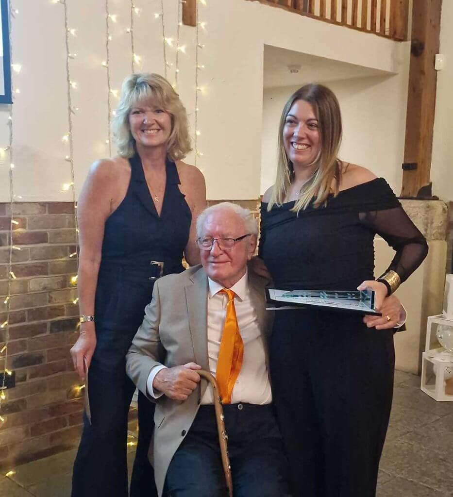 Lynsey Tran receives West Sussex's Care Award for Dementia Excellence. She is pictured with Sandy and daughter Sue.