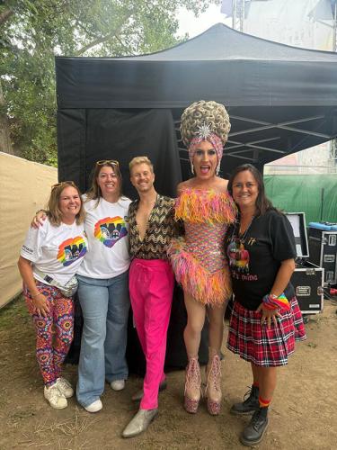 Beehive Care staff at Worthing Pride with a drag queen